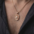 Load image into Gallery viewer, Rose gold plated horse necklace worn on the chest, showcasing the three-dimensional equestrian horse portrait, beautifully detailed mane, expressive facial features, ornamental bridle, and bold shield-shaped animal pendant.
