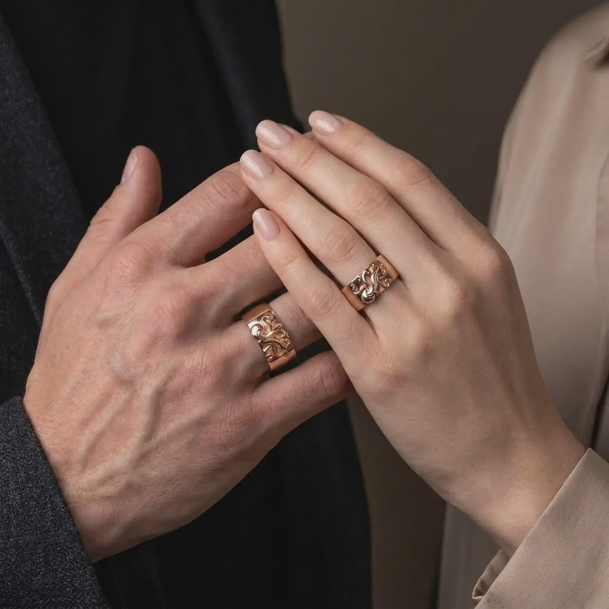 Rose gold plated 925 sterling silver matching nautical octopus rings worn on the fingers of a man and woman together, highlighting raised octopus sculptures, curling tentacles, intricate suction cup patterns, wide bands, and coordinated rose gold plated finishes.