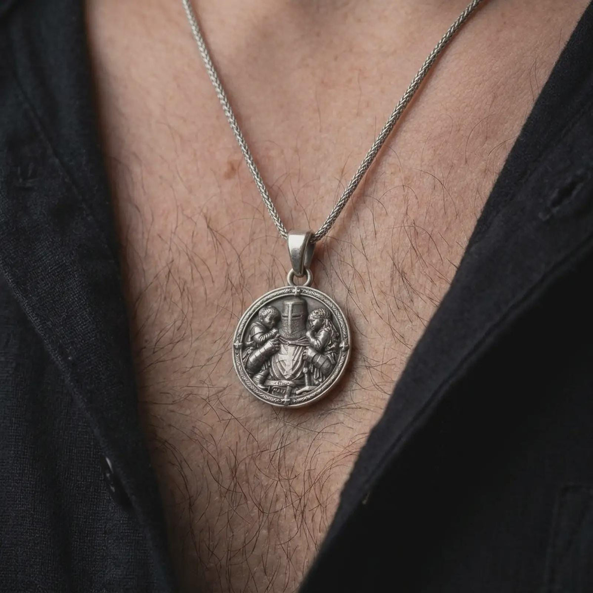 Oxidized sterling silver knight protecting children necklace worn on the chest, showing the armored guardian, two children, detailed medieval helmet, and meaningful fatherhood-inspired jewelry design.