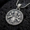 Load image into Gallery viewer, Oxidized sterling silver Templar knight protecting children pendant on black volcanic rock, featuring a cross-marked medieval helmet, armored warrior, two children, and an ornate circular border.
