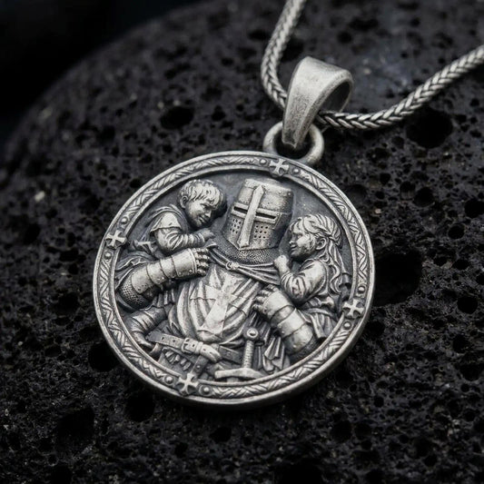 Oxidized sterling silver Templar knight protecting children pendant on black volcanic rock, featuring a cross-marked medieval helmet, armored warrior, two children, and an ornate circular border.