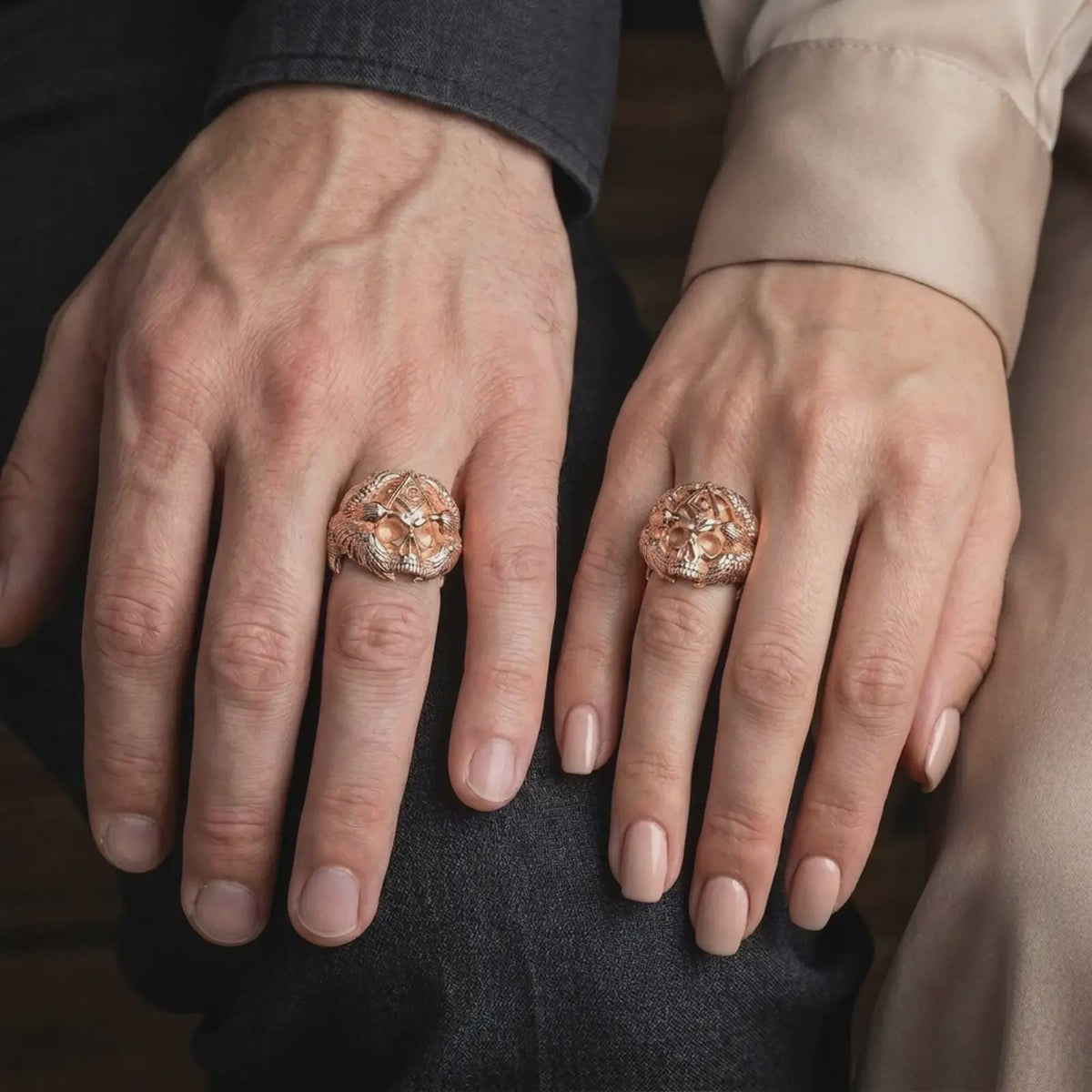 Rose gold plated Freemason skull ring worn on the hand, showcasing the intricate skull sculpture, Masonic G symbol, eagle wings surrounding the skull, and powerful gothic men's jewelry aesthetic.