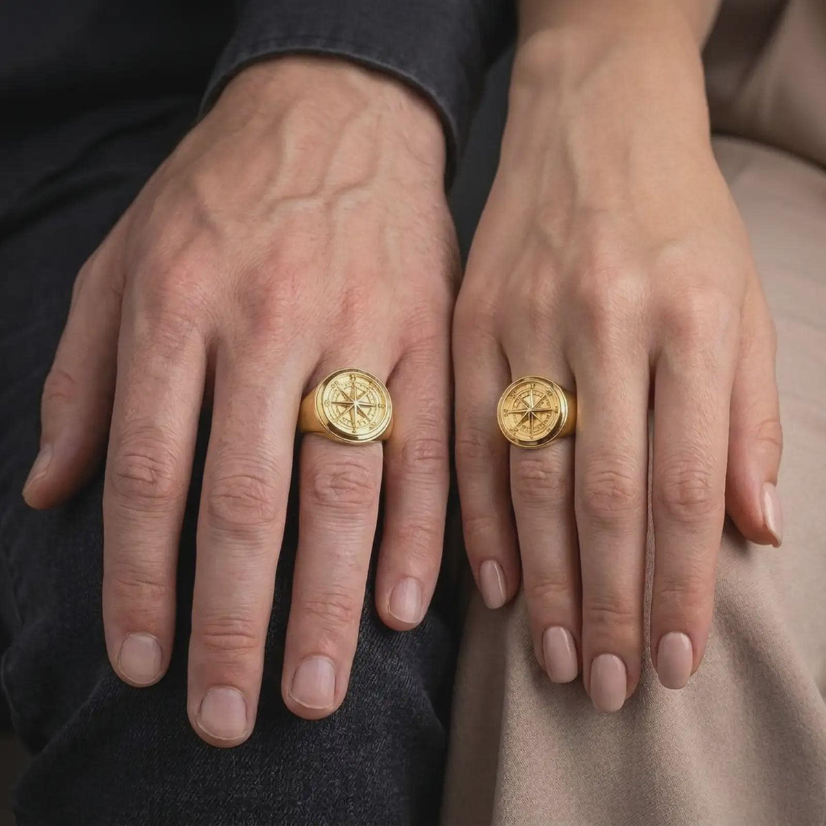 Gold plated compass signet ring worn on the finger, highlighting the dimensional eight-point compass star, engraved cardinal directions, smooth round bezel, and distinctive sailor-inspired jewelry design.