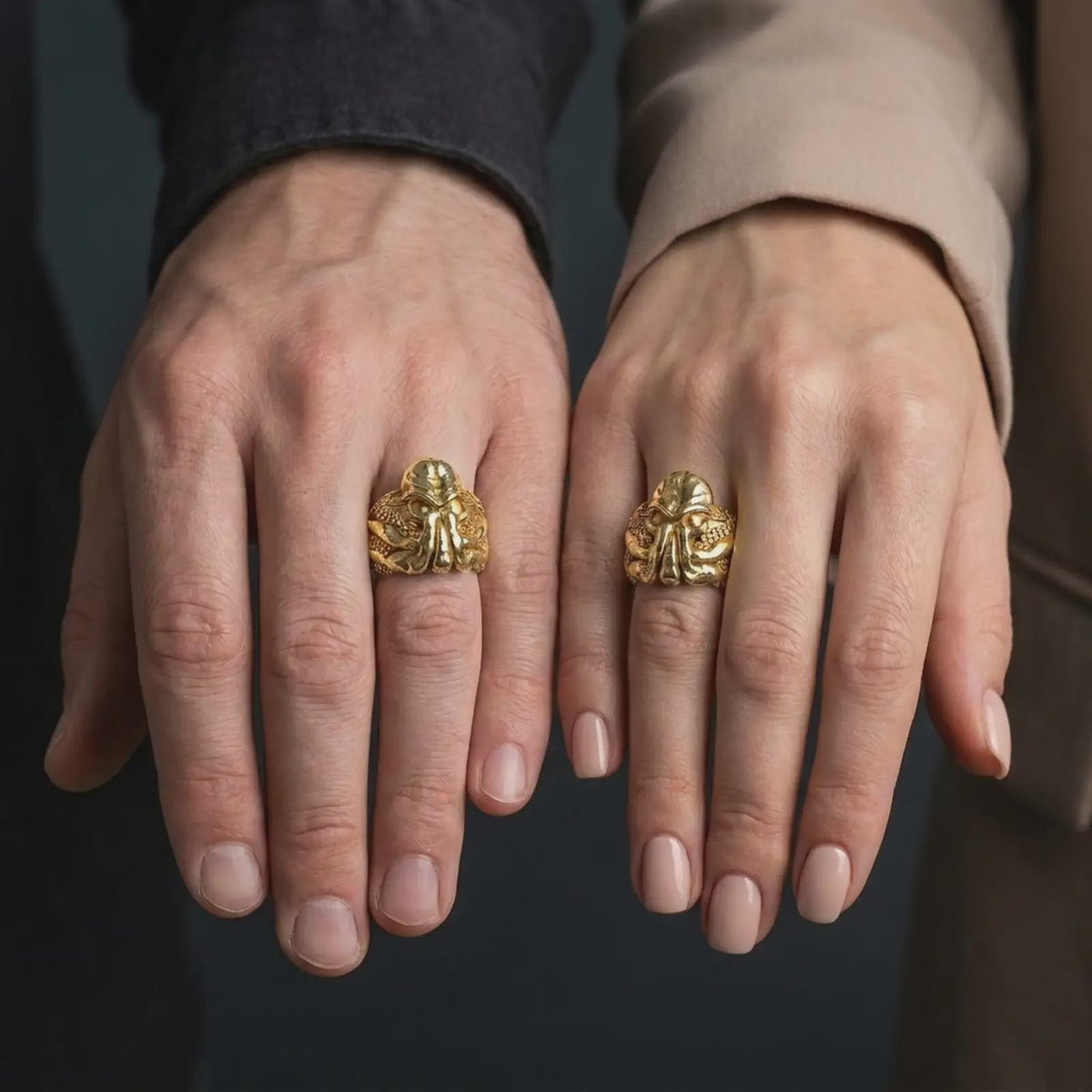 Gold plated eldritch horror Cthulhu ring worn on the finger, highlighting the monstrous octopus-like face, raised forehead, curling tentacles, and bold H. P. Lovecraft-inspired fantasy jewelry design.