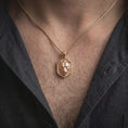 Load image into Gallery viewer, Rose gold plated lioness pendant worn on the chest, showcasing the three-dimensional wild cat portrait, elegant facial details, textured background, and distinctive symbolic animal necklace design.
