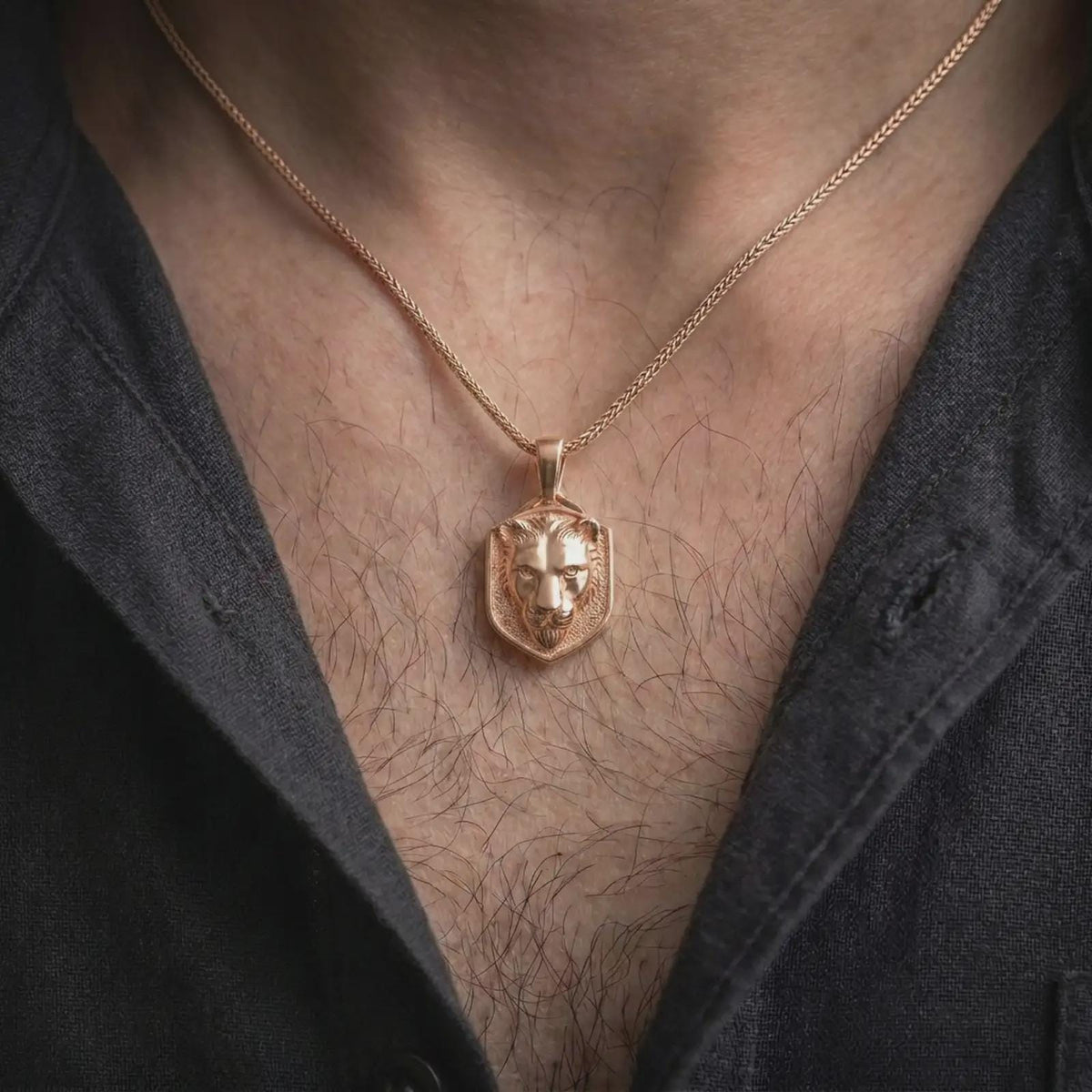 Rose gold plated lioness pendant worn on the chest, showcasing the three-dimensional wild cat portrait, elegant facial details, textured background, and distinctive symbolic animal necklace design.