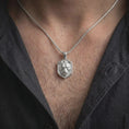 Load image into Gallery viewer, Polished silver lioness necklace worn on the chest, featuring the dimensional lioness head sculpture, expressive eyes, realistic feline contours, and bold wildlife-inspired pendant frame.
