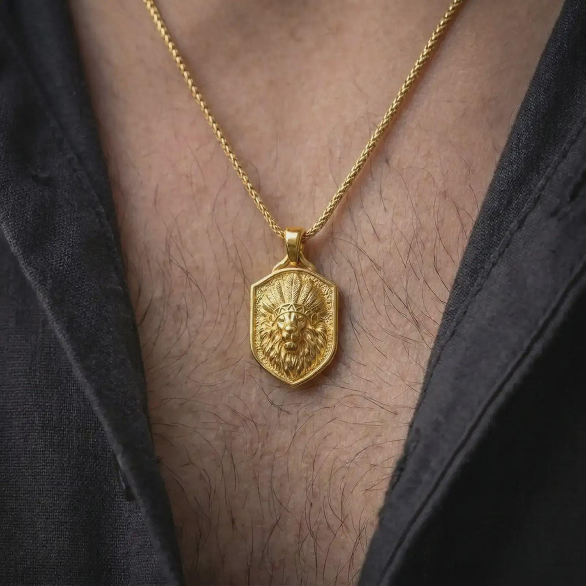 Gold plated warrior lion pendant worn around the neck, highlighting the sculpted lion face, elaborate feather crown, flowing mane, detailed wildlife features, and bold masculine animal jewelry design.