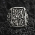 Load image into Gallery viewer, Oxidized Silver Saint Peter and Paul signet ring on black volcanic rock, featuring both haloed apostles with detailed keys, sword, and book symbolism.
