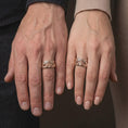 Load image into Gallery viewer, Rose gold plated 925 sterling silver matching Masonic hands rings worn on the fingers of a man and woman together, highlighting detailed hand sculptures, raised compass and square emblems, central G letters, and coordinated rose gold plated finishes.

