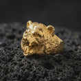 Load image into Gallery viewer, Gold plated 925 sterling silver roaring bear ring displayed on textured black volcanic rock, featuring a highly detailed three-dimensional bear head, aggressive open-mouthed expression, sharp teeth, textured fur, and warm gold plated finish.
