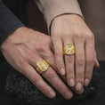 Load image into Gallery viewer, Gold Plated Saint Cecilia rings displayed on the fingers of a man and woman together, featuring the sculpted patron saint of musicians.
