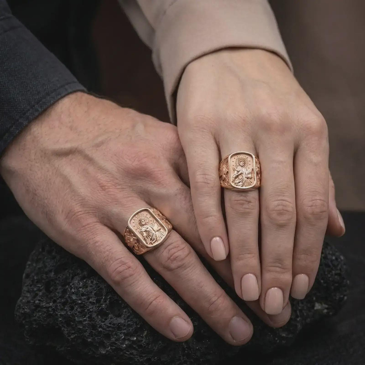 Rose Gold Plated Saint Cecilia Catholic rings worn by a man and woman together, emphasizing the rectangular religious relief and ornate cross motifs.